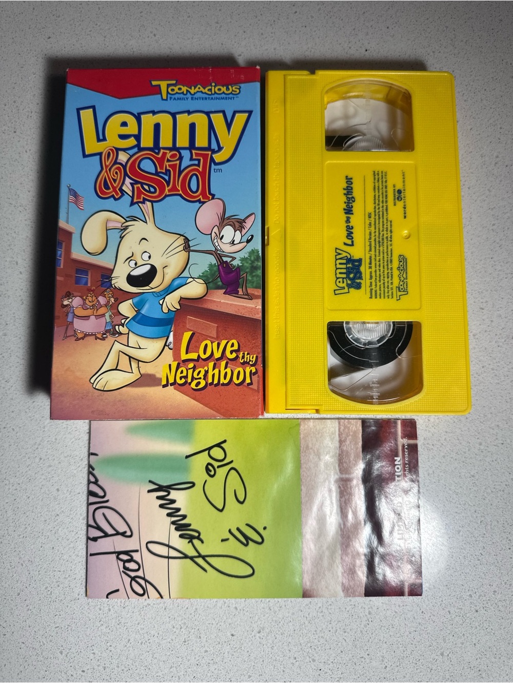 Lenny & Sid: Love Thy Neighbor Yellow VHS with poster